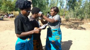 the lions club Mhuju Temwachi distriubting reading glasses